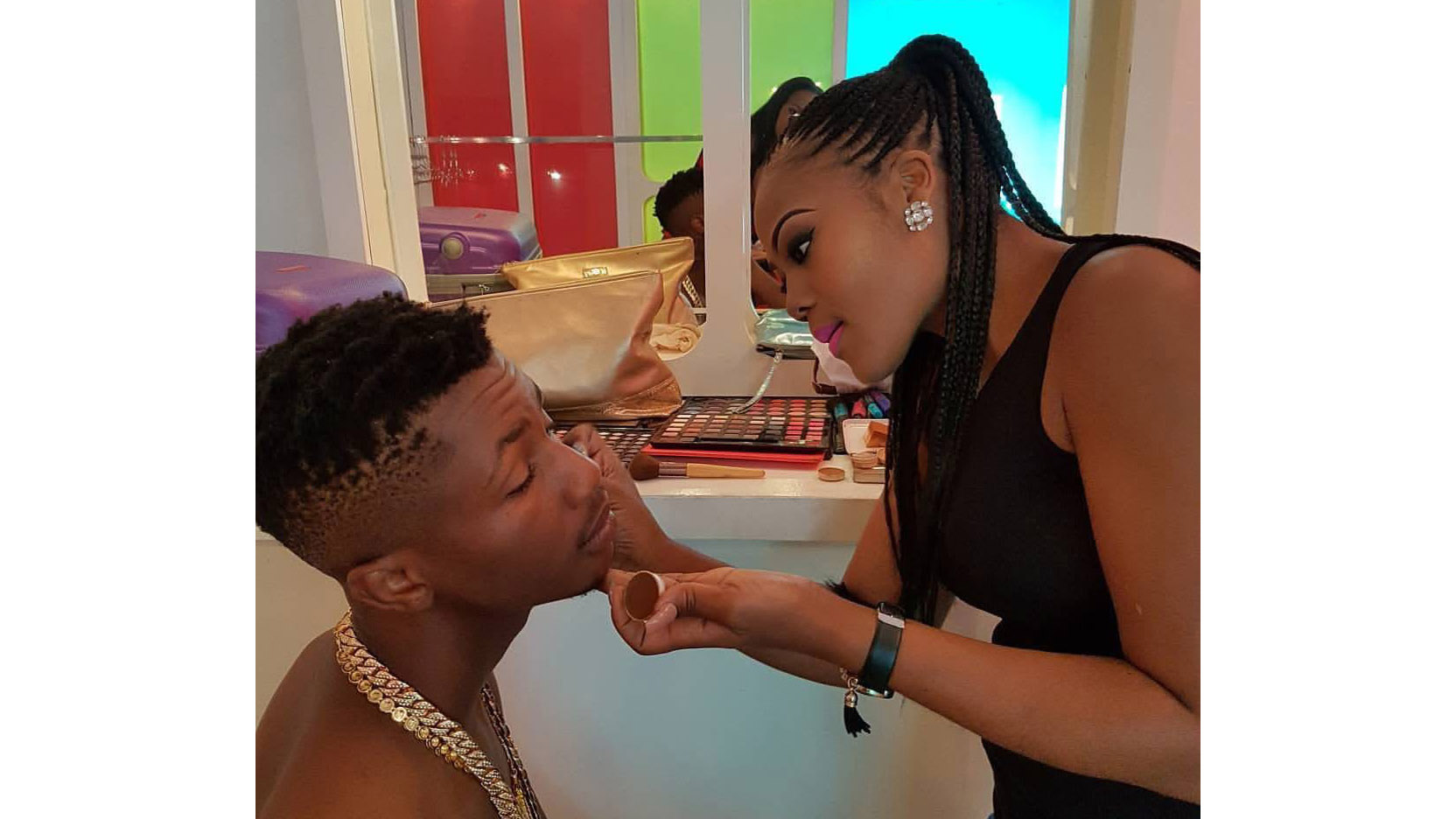  Zamo applies make-up to South African Rap artist Emtee. 